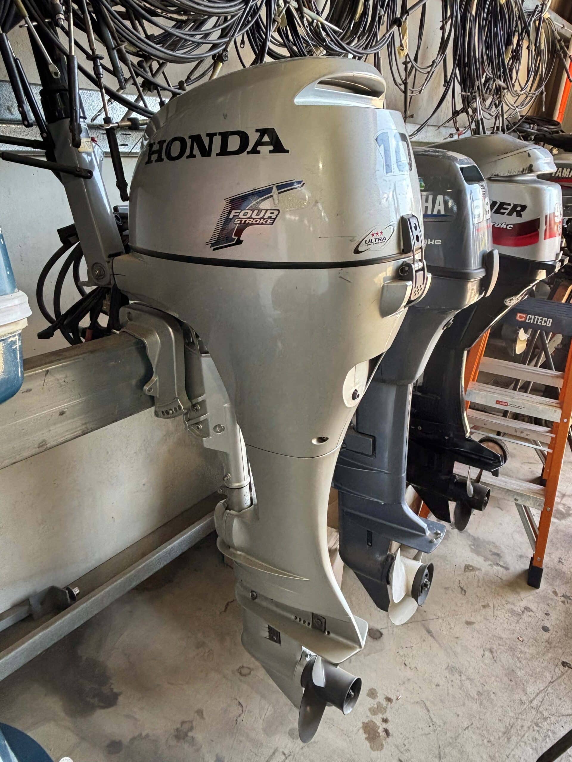 this shows a honda 10hp outboard on an outboard stand