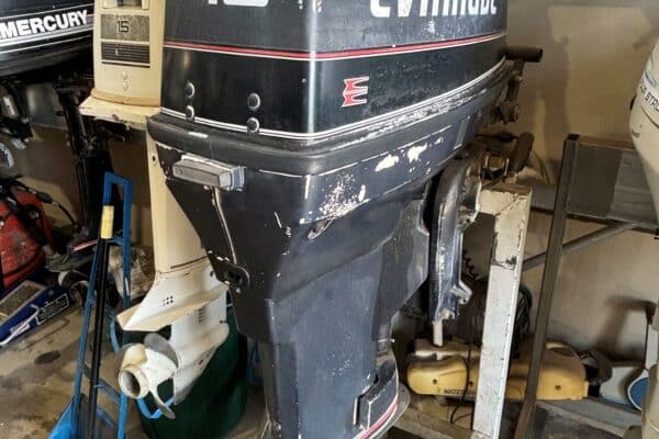 this shows a evinrude 40hp outboard sitting on a outboard stand