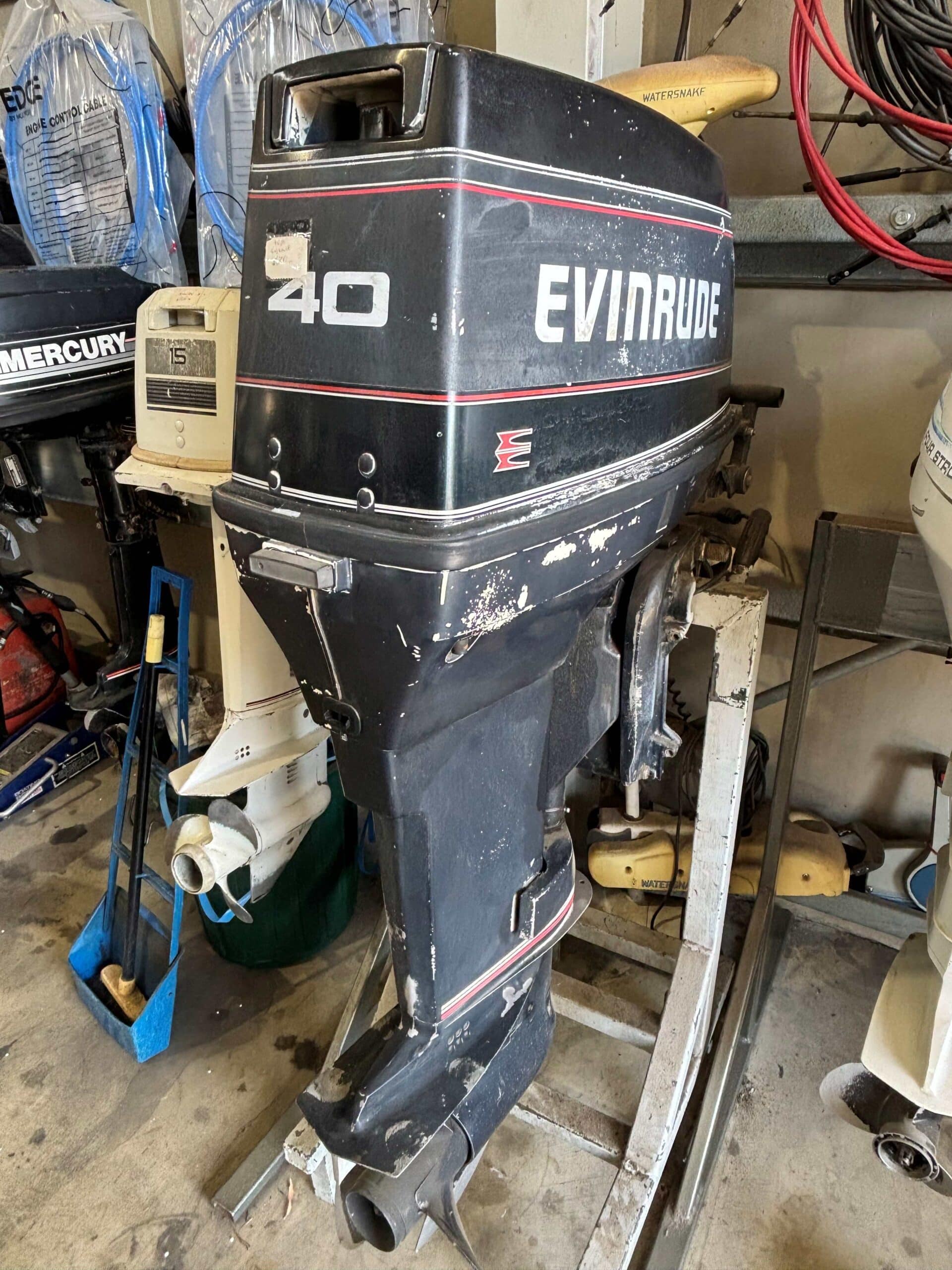 this shows a evinrude 40hp outboard sitting on a outboard stand